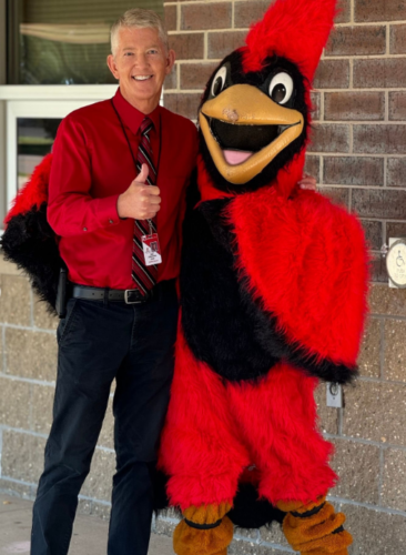 Alexandria Public Schools photo of mascot with school leader